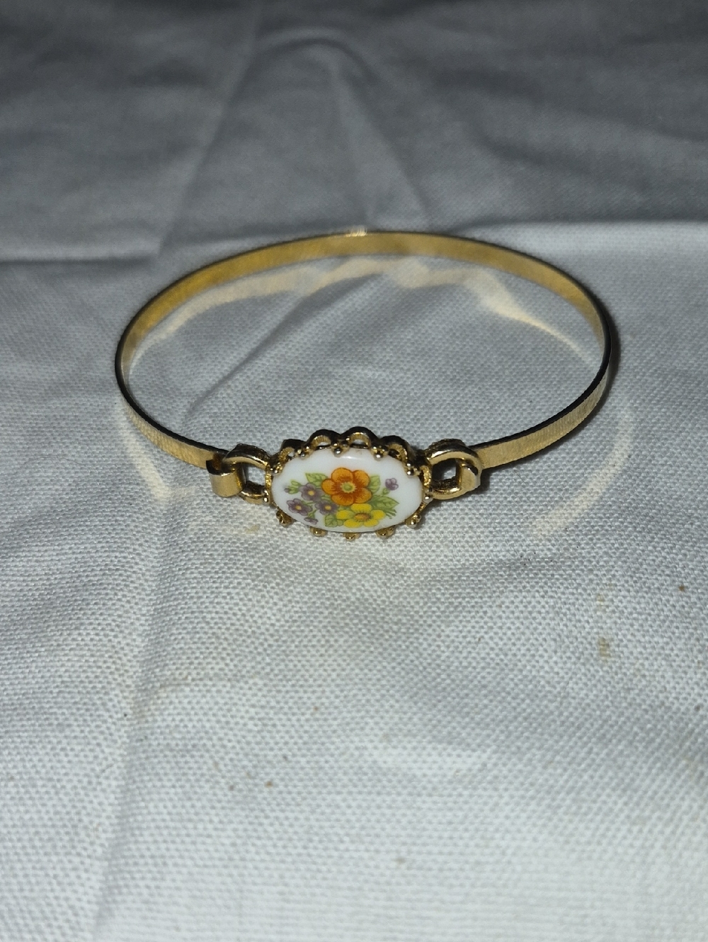 Avon Gold-Tone Bangle with Orange Floral Porcelain Medallion